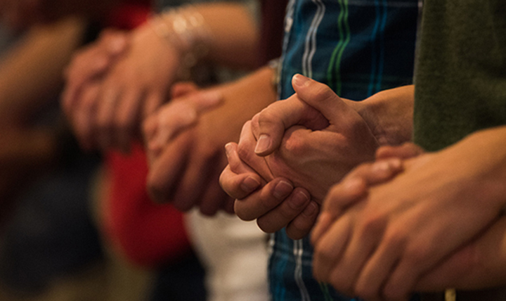 People in group prayer.