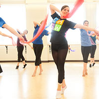 Dancers practice in studio rehersal area.
