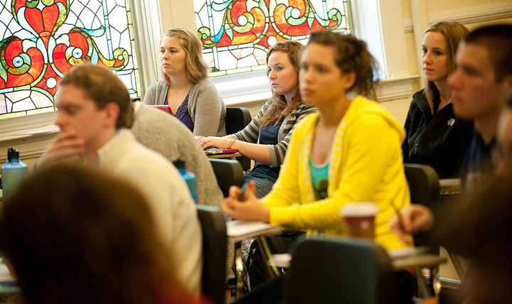 Students in classroom stained glass window.