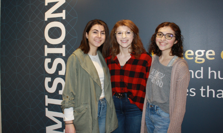Student walking on campus near Rudolf Fitness Center