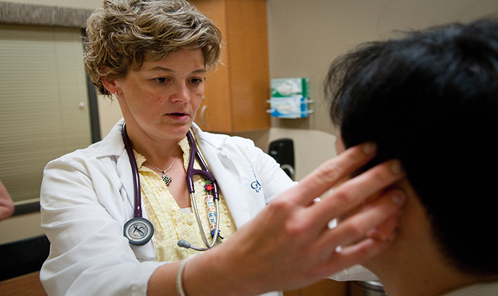 nurse working on patient