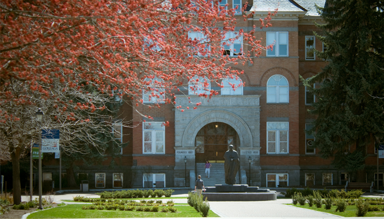 Front of college hall in the fall.