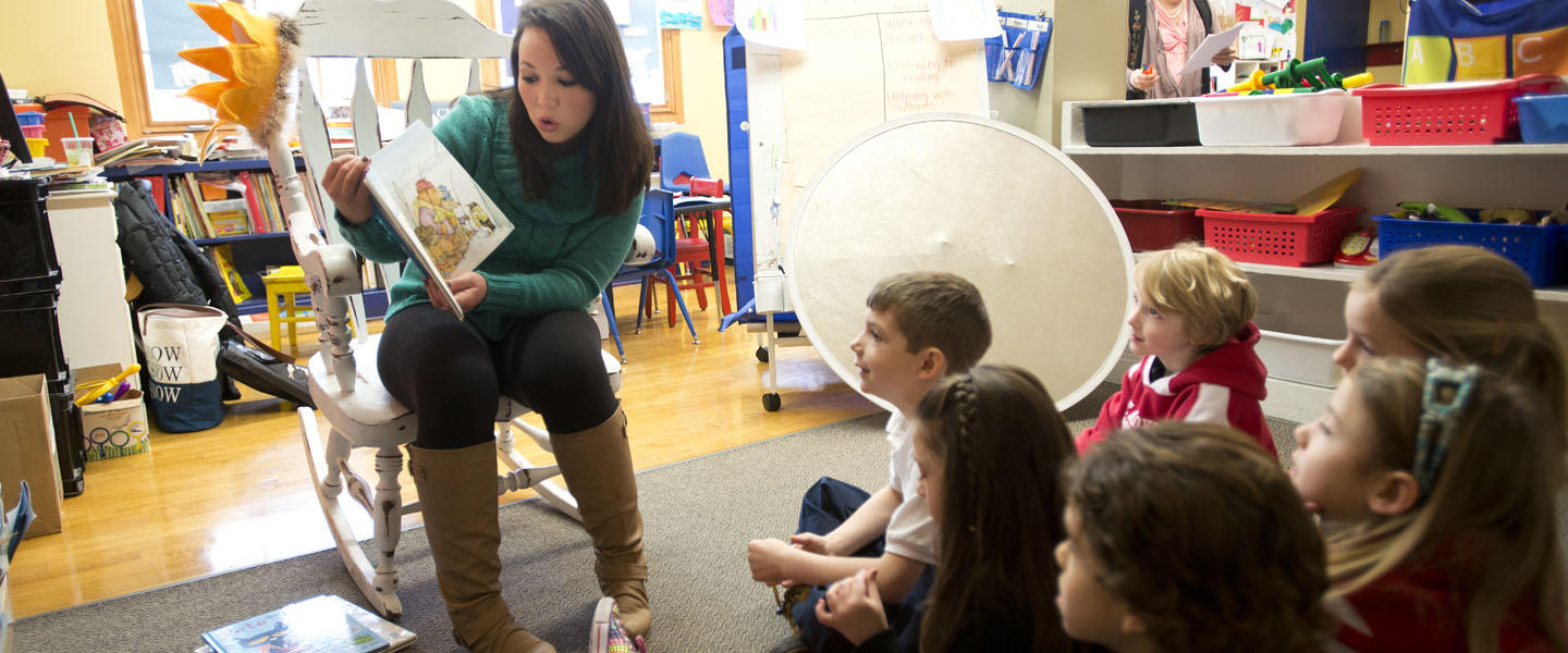student reading to kids 