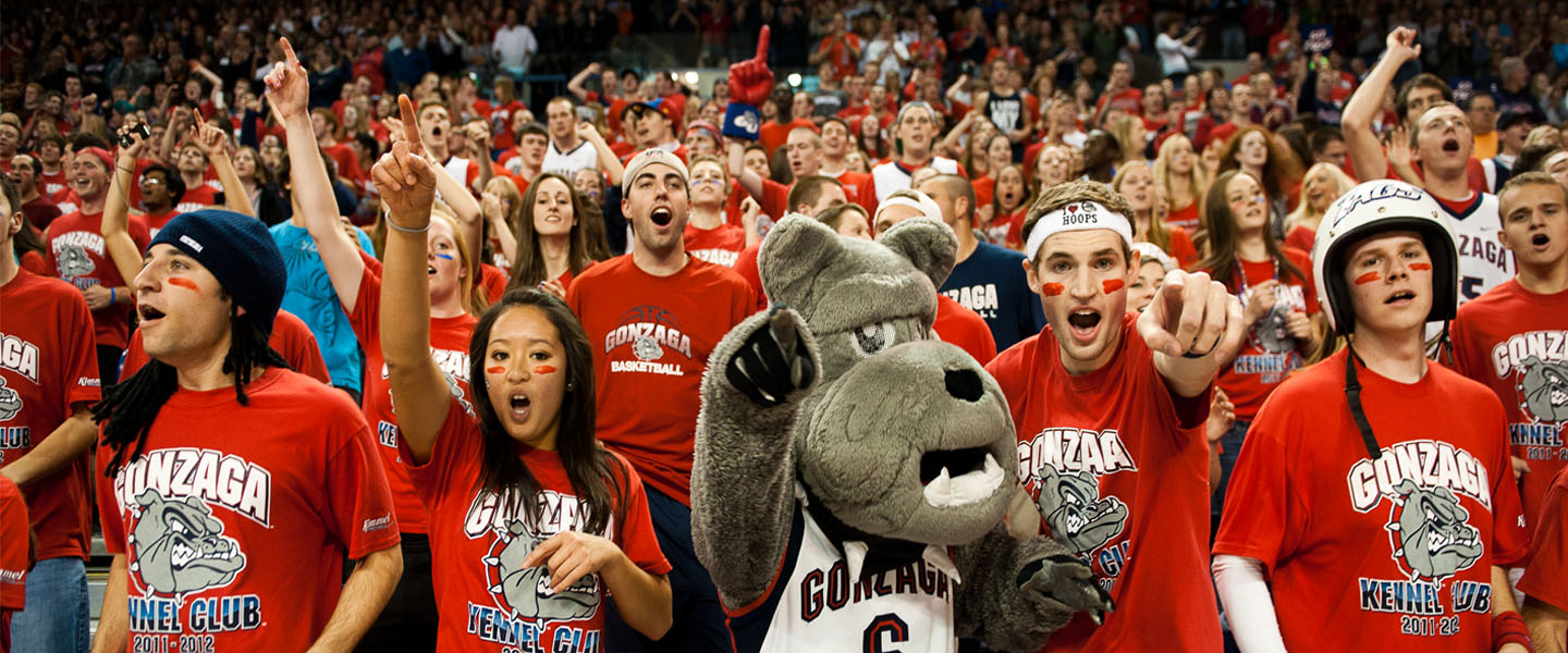 Students and Spike cheer at basketball game 