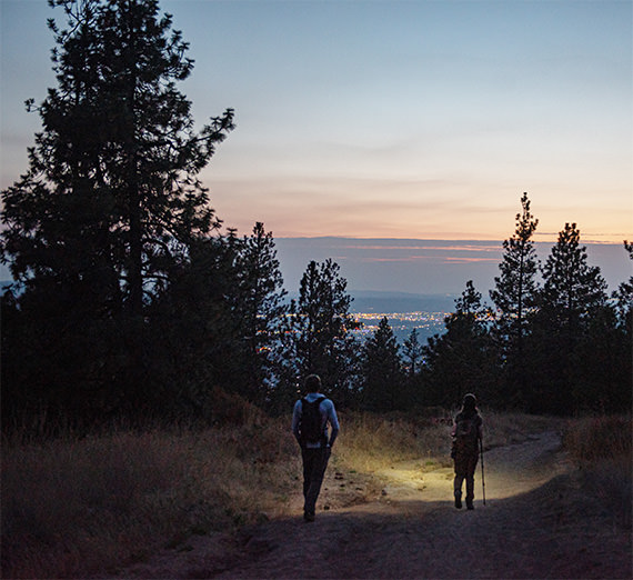 students hiking at night