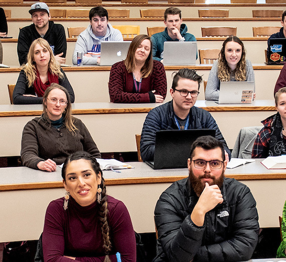 Students listen to a lecture in the Barbieri Courtroom
