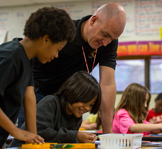 A student participates in a teaching exercise at the Salish School