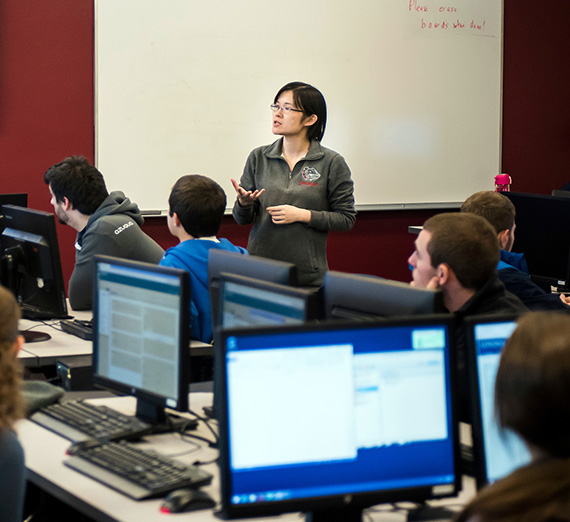 Students listen to a lecture in a computer lab