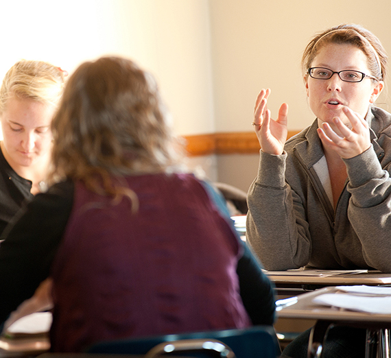 A students asks a question during class.