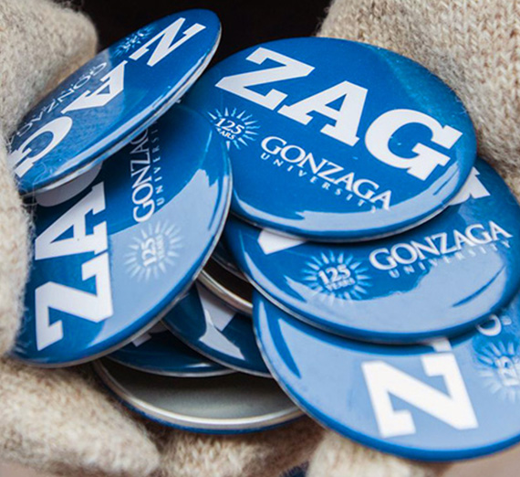Person holding Zag buttons