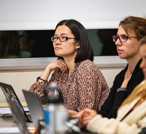 student with laptop in classroom