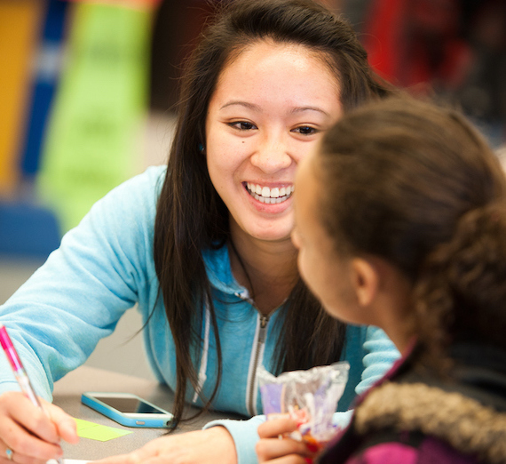 Girl tutoring a little girl