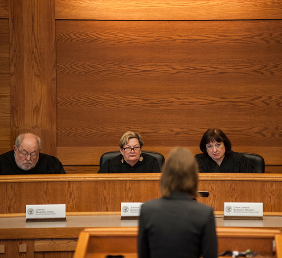 Student facing judges in courtroom