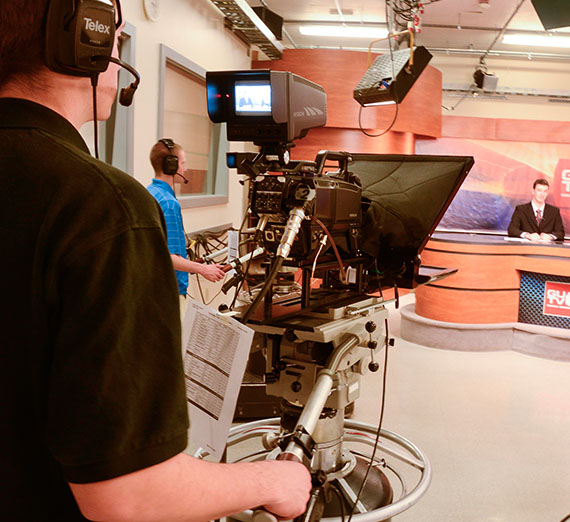 Student running the camera for GU TV.