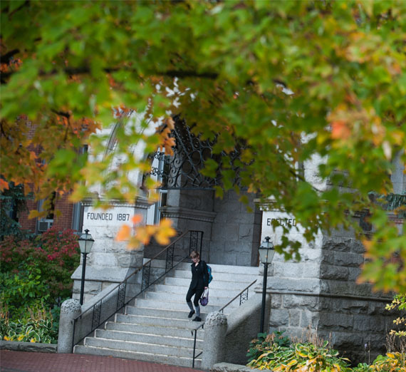 student walking out of college hall 