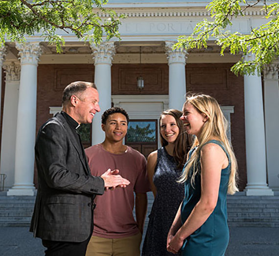 Fr. Stephen Hess meets with students 
