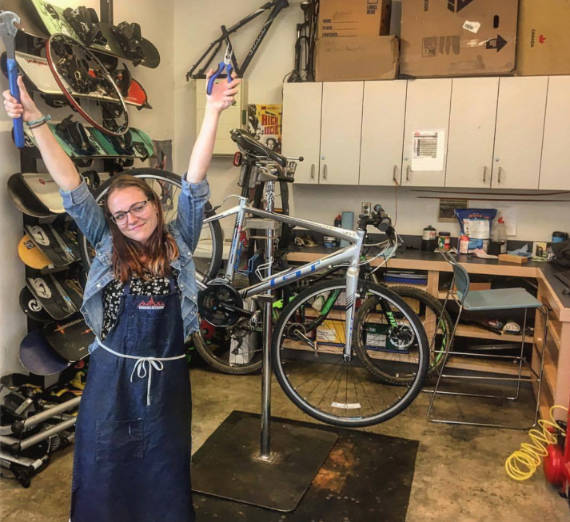be you at GU. female student in bike shop
