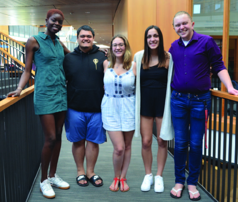 Five CCE students posing in a group photo