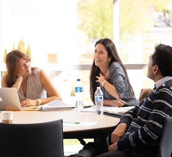 Man gives a lecture to a few people