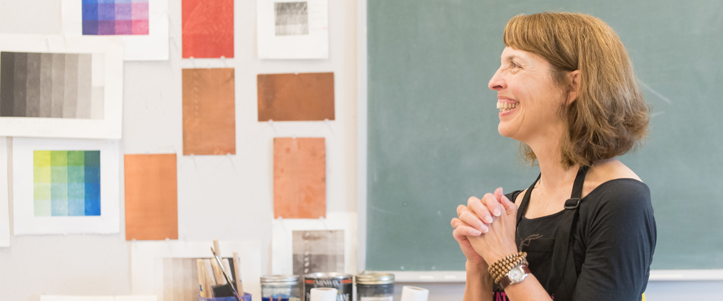Art professor Mary Farrell smiles