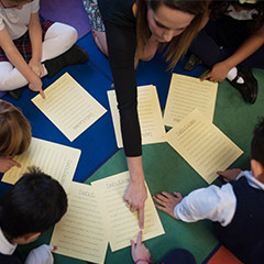 Student teaching kids at St. Madeleine's School 