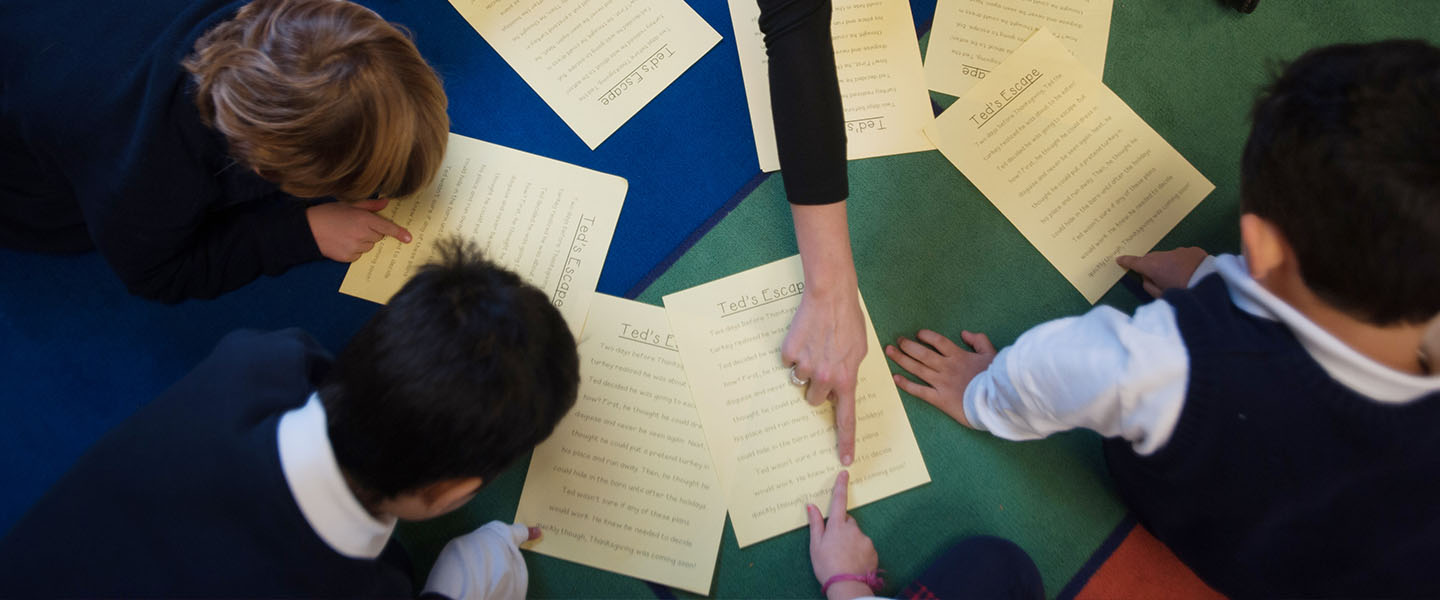 Student teaching kids at St. Madeleine's School 