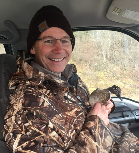 Dr. Hayes holding a duck