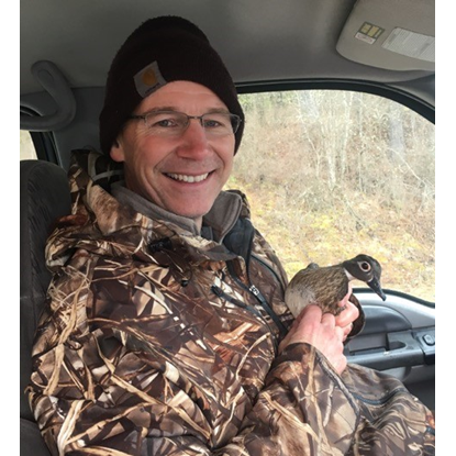 Dr. Hayes holding a duck
