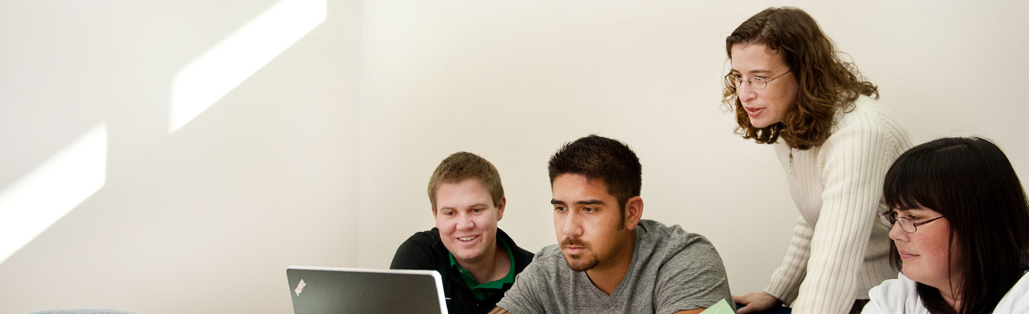 Faculty member teaching students in Gonzaga's fraud lab.