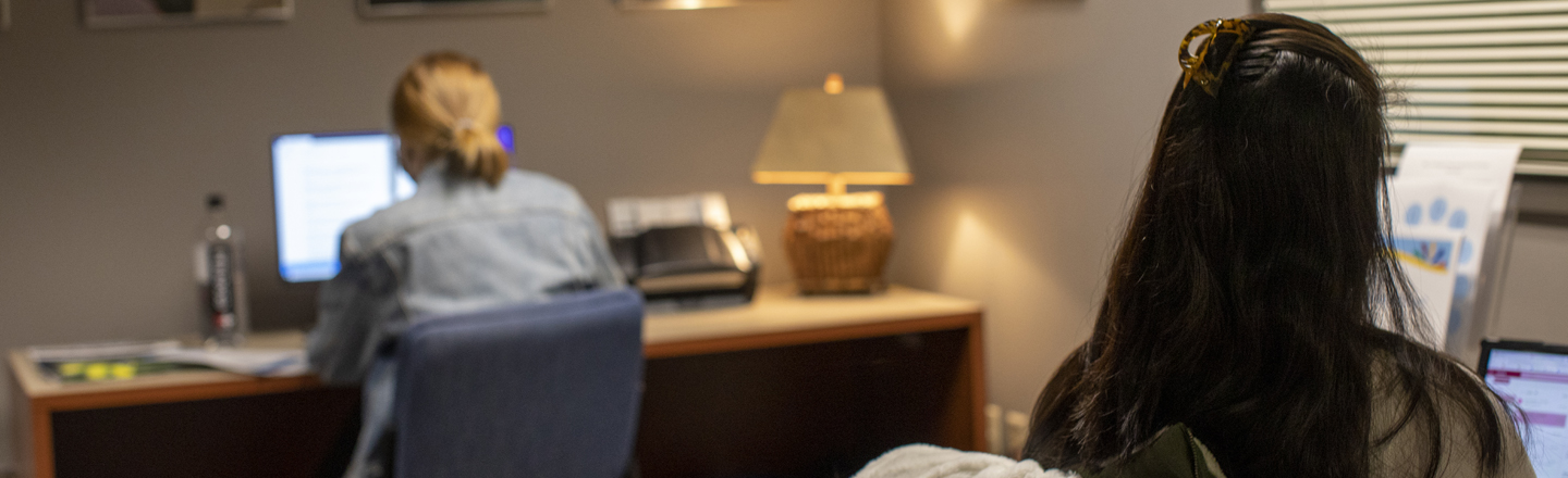 Grad assistants work in the office.