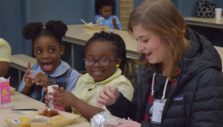 Gonzaga student Olivia Moorer with children from Resurrection School in Montgomery Alabama