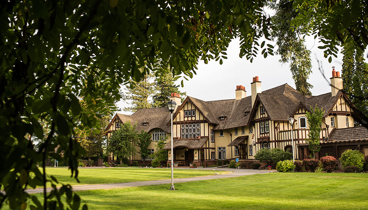 View of Bozarth Mansion framed by surrounding foliage
