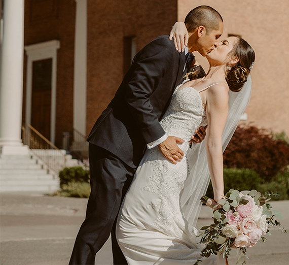 couple kisses outside St Aloysius Church