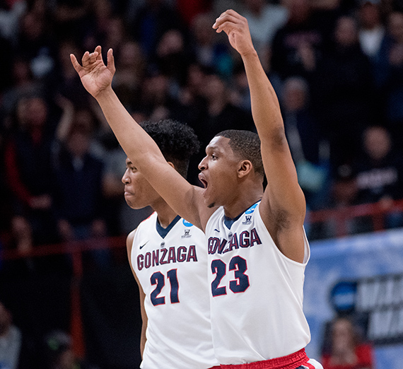 (from left) Rui Hachimura and Zach Norvell Jr. celebrate their win Thursday over UNCG. (GU photo by Zack Berlat)