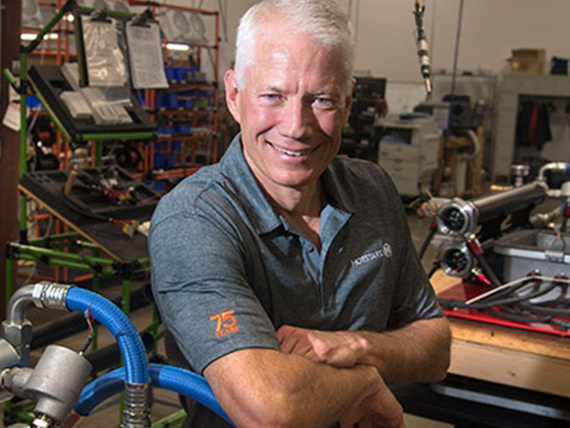 Terry Judge poses in an engineering lab.