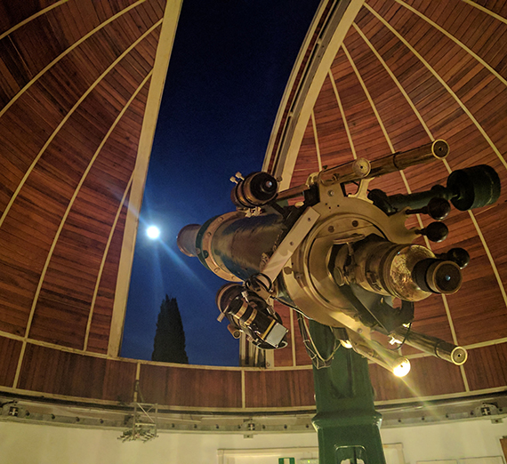 Telecscope peering through roof opening at Arcetri Observatory South of Florence