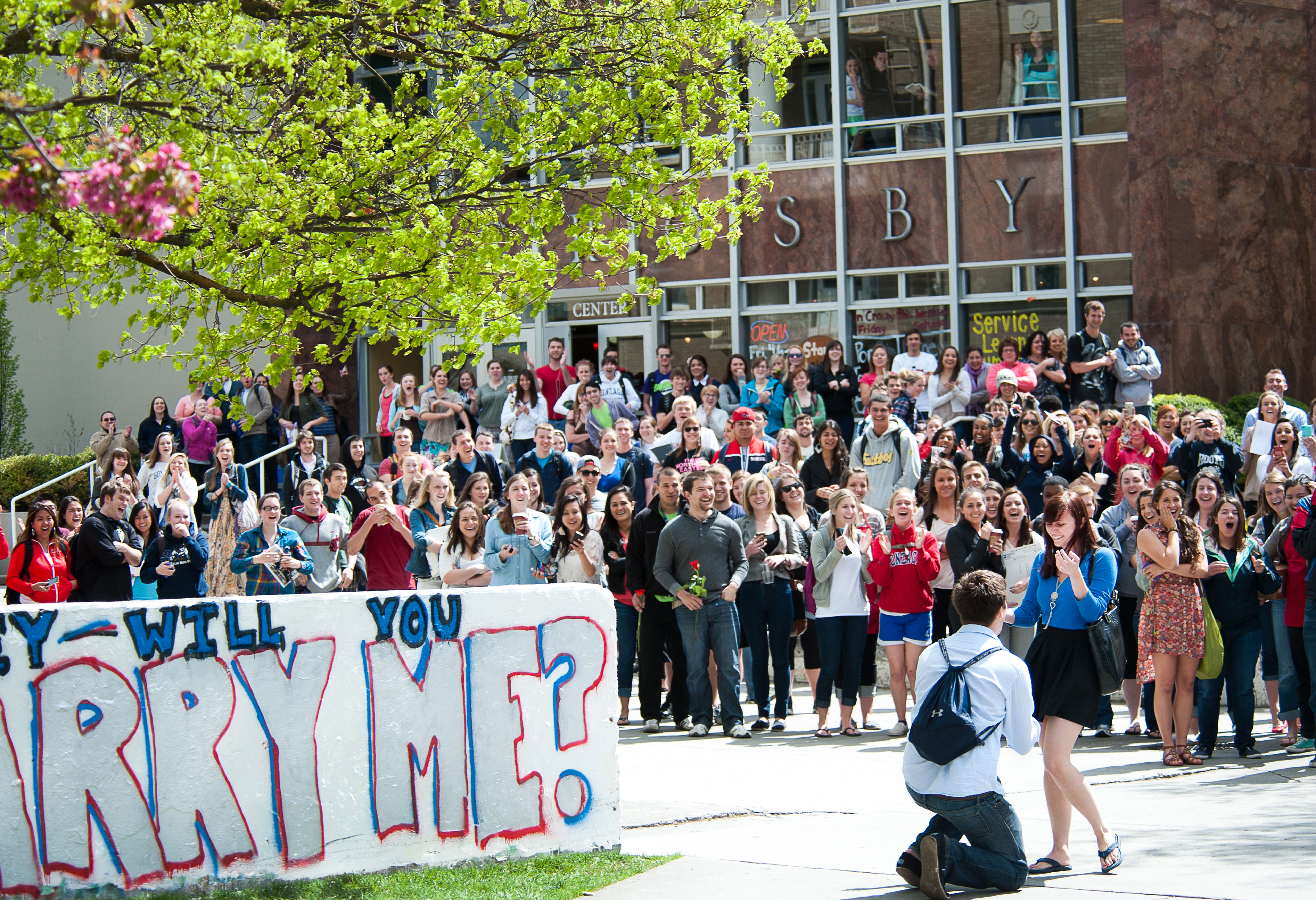 students get engaged in front of zagwall 