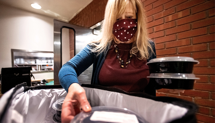 Sodexo staff packages meals for delivery to students