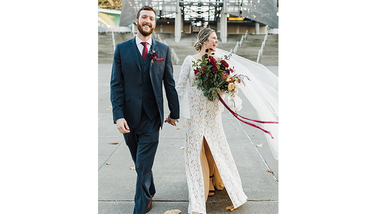 bride and groom exiting building