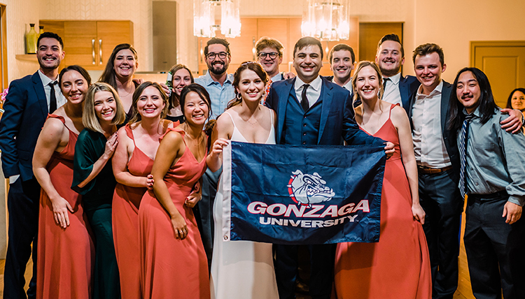 weddding party holds gonzaga flag