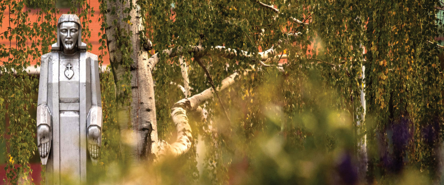 Aluminum Jesus statue on campus
