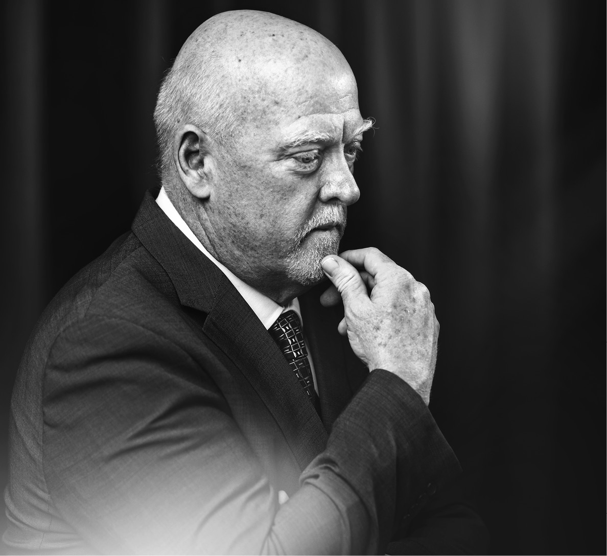 black and white image of man pensive