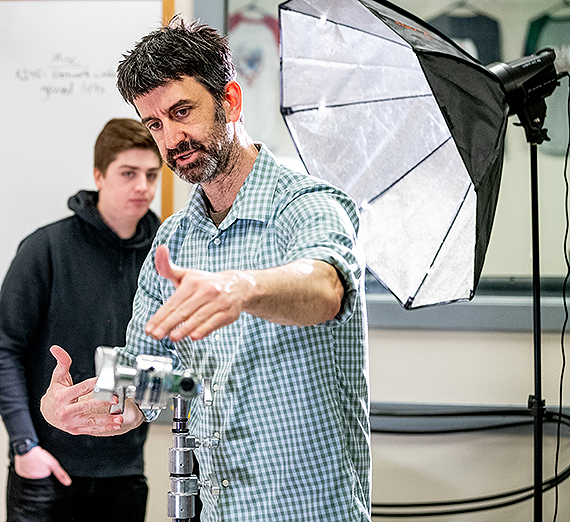 Matt McCormick instructs a student in a lighting class. (GU photo)