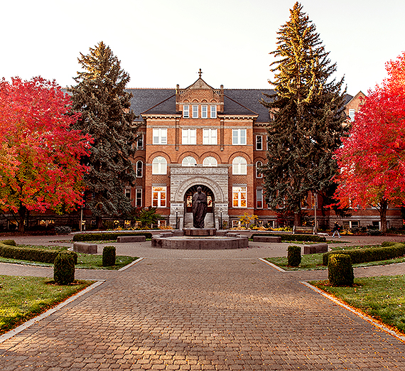 4 students of the GUide Core group speaking to an audience.