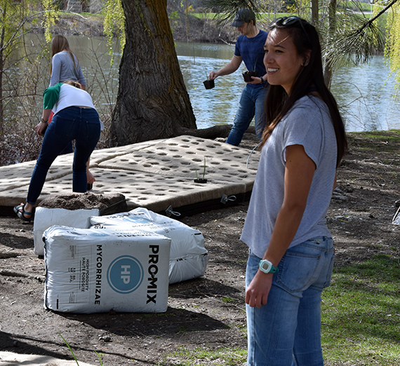 Students installed a pair of floating islands to provide a foothold for native plant species, turtles, and waterfowl. (Photo courtesy Greg Gordon)