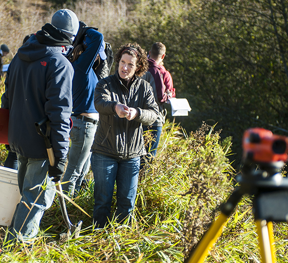 Sue Niezgoda, associate professor of civil engineering, leads a stream restoration class along the Little Spokane River. (GU photo) 