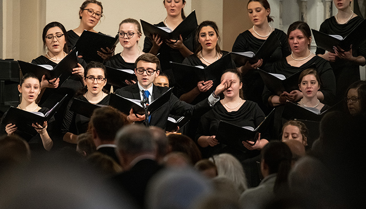 Gonzaga student choir honors Fr. Coughlin.