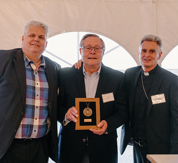 Gene Dire receiving award. 