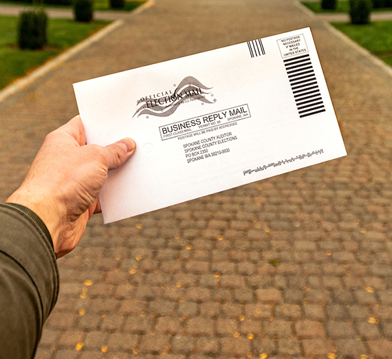 Hand holding up a ballot