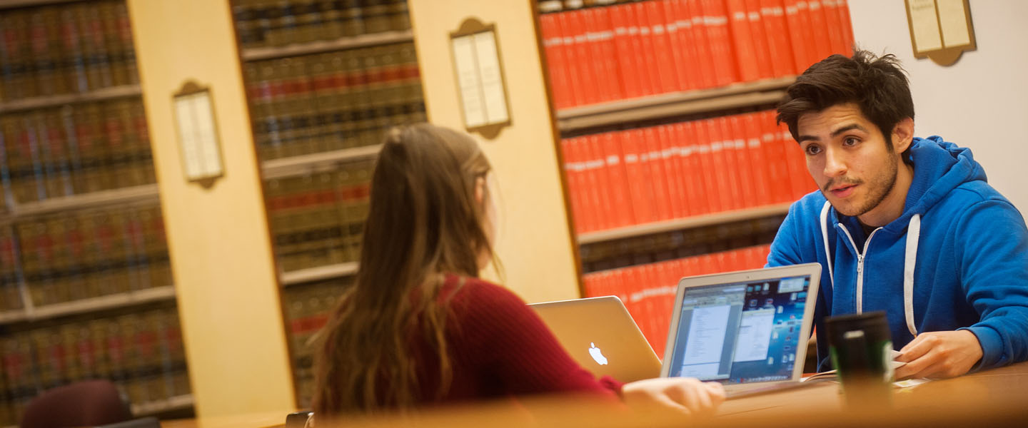 Students studying together in library 